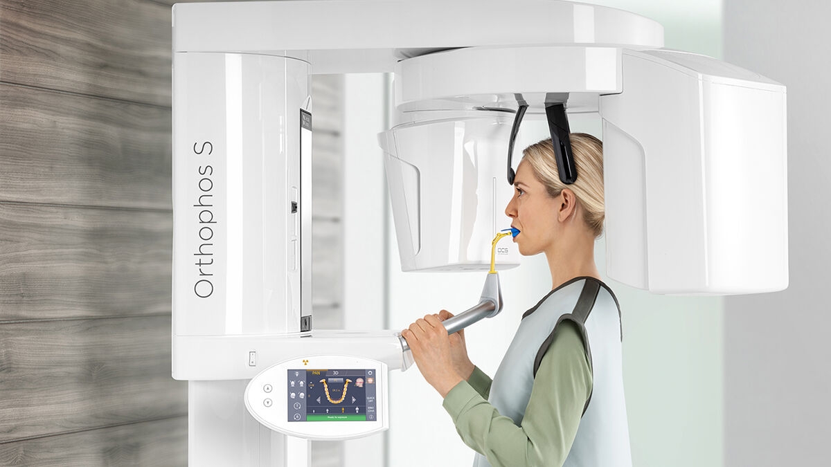 Patient during x-ray scan with Orthophos S